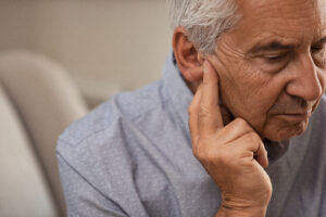Senior man with hearing problems | Healthier Me Today