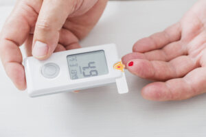 Person Measuring Blood Sugar Levels | Healthier Me Today