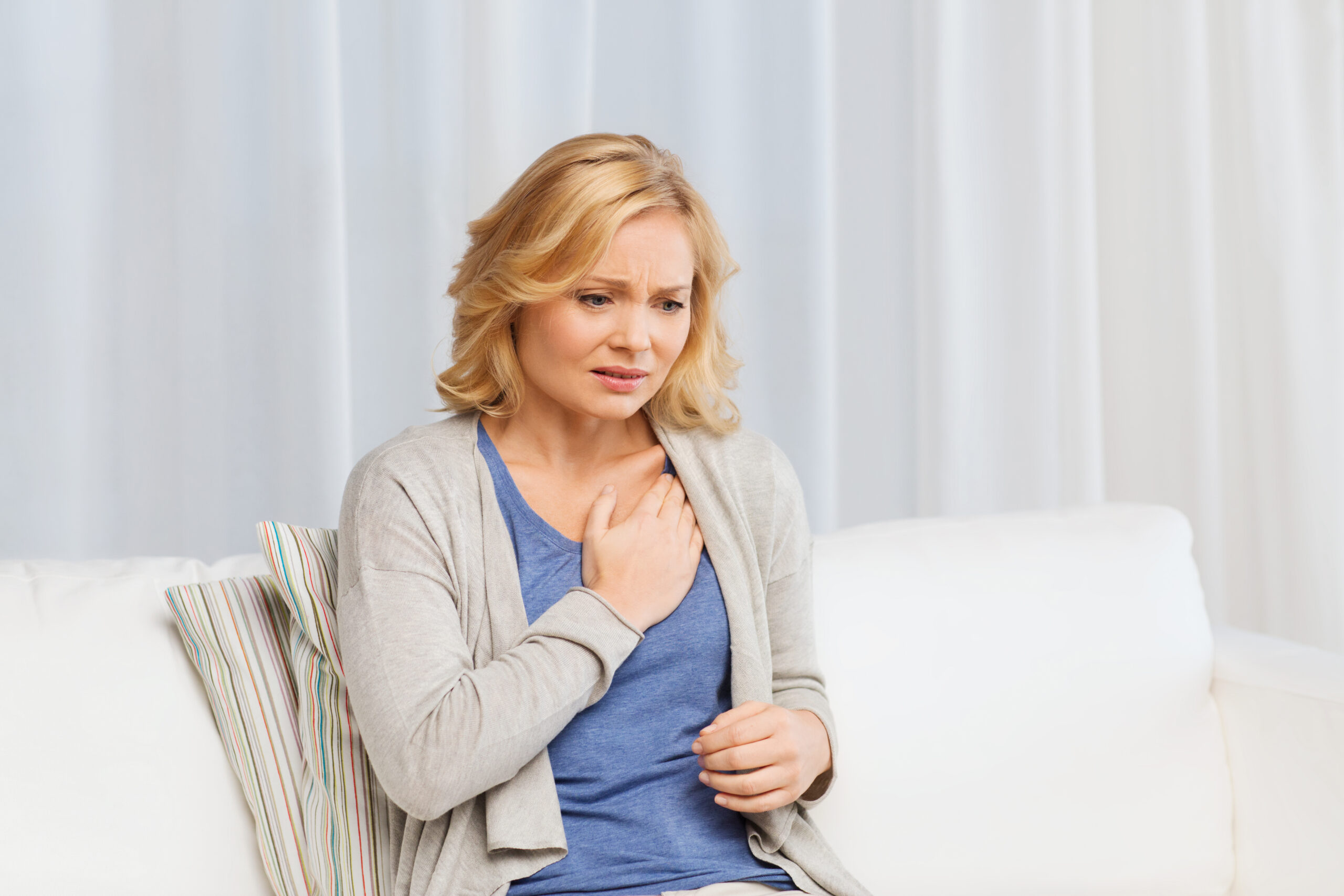 unhappy woman suffering from heartache at home | Healthier Me Today