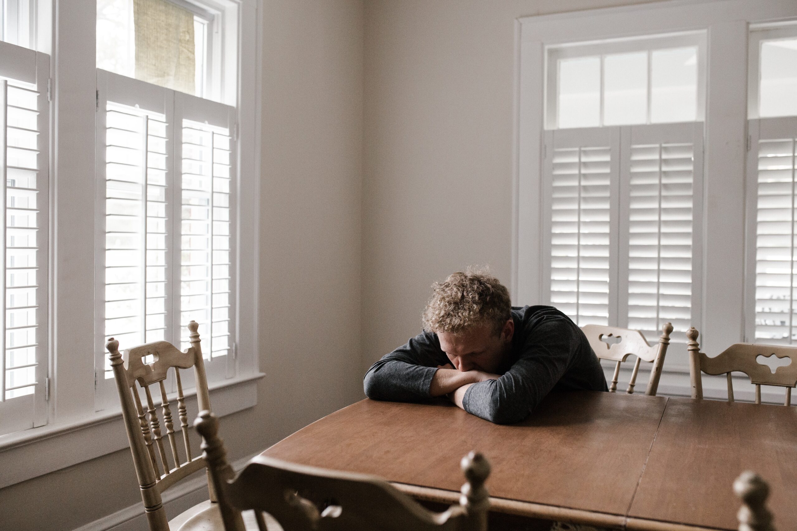 Man sitting at the table | Healthier Me Today
