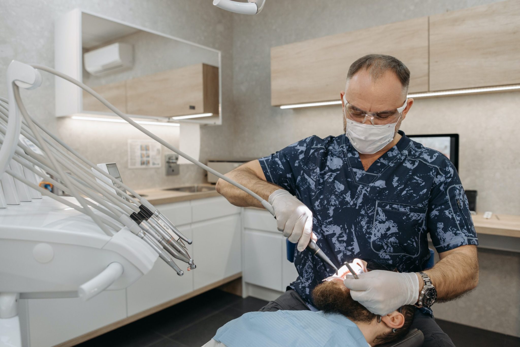 Are Dental Implants Covered By Insurance - man at dentist | Healthier Me Today