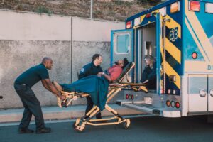 Person in ambulance - does medicare cover ambulance | Healthier Me Today