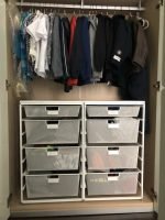 closet, hanging clothes, metal storage bin on the wooden floor // Healthier Me Today