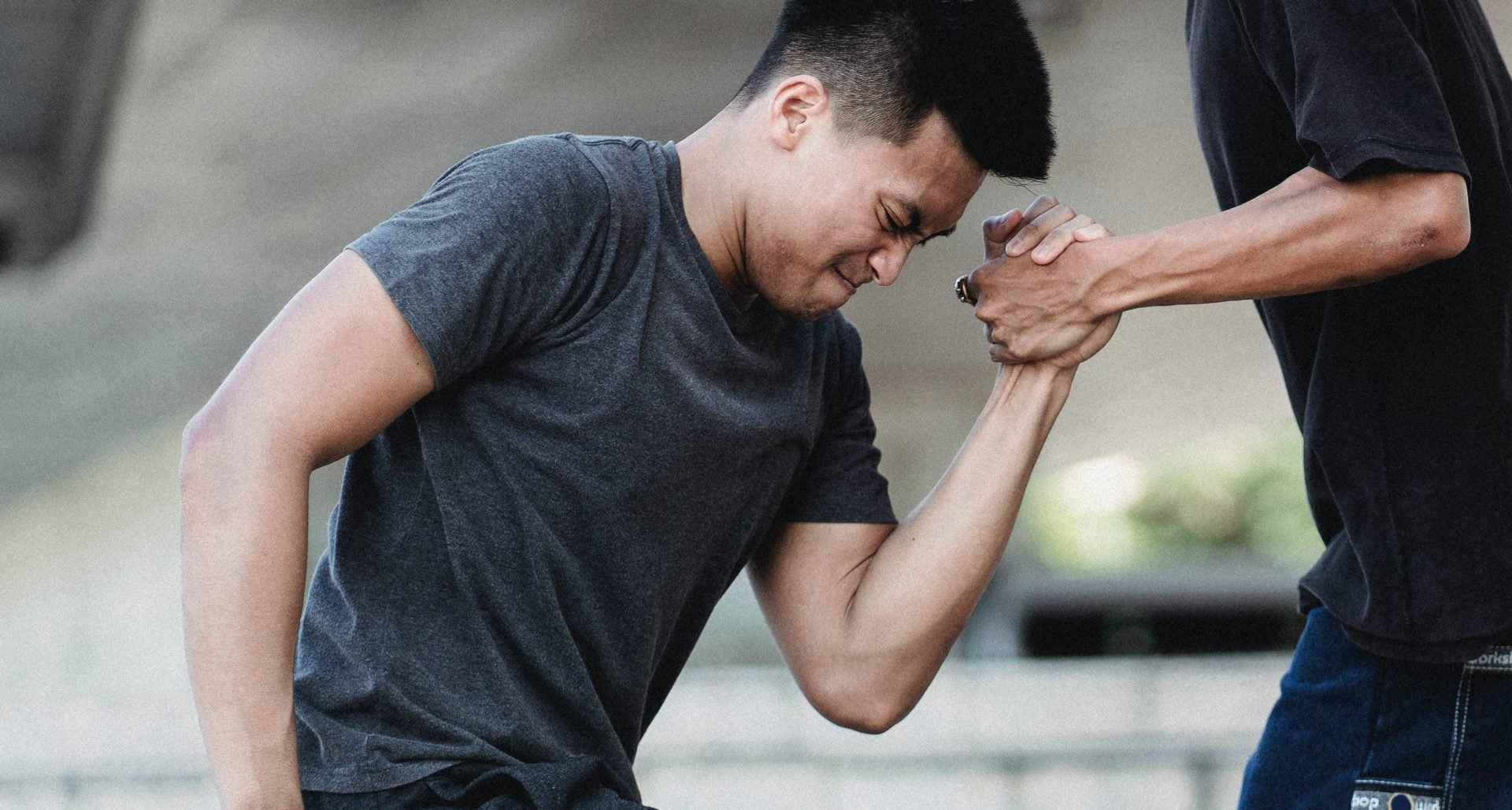hurt man, workout clothes, someone helping him up, blurred background // Healthier Me Today