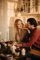 couple having a romantic dinner at home, man and woman sitting at table // Healthier Me Today