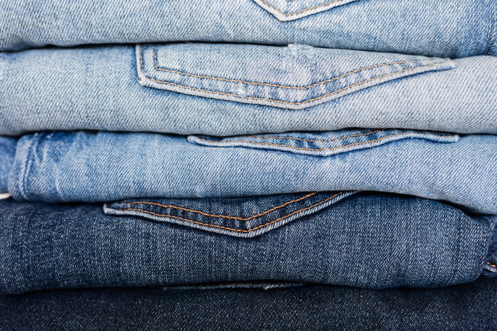 multiple blue jeans stacked on top of each other // Healthier Me Today