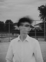 blurry black and white photo, tennis court, big tree // Male Breast Cancer // Symptoms of Male Breast Cancer // Healthier Me Today