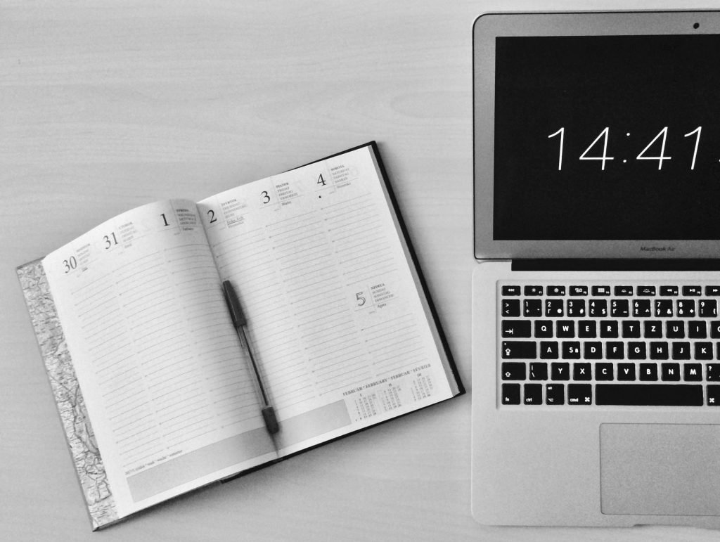 silver laptop, open diary, time, light silver counter // Healthier Me Today