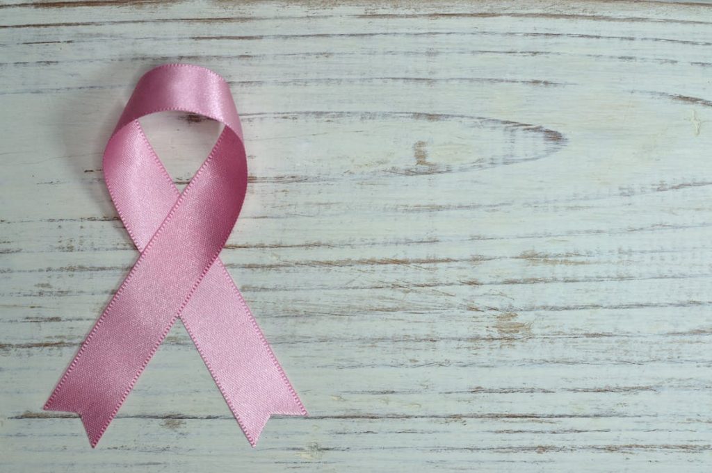 Breast Cancer Awareness on Teal Wooden Surface // Healthier Me Today