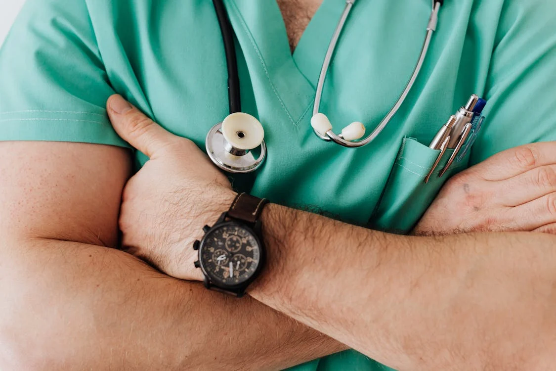 Crop unrecognizable male doctor with stethoscope // Healthier Me Today