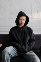 Man in Black Hoodie Sitting on Brown Couch // Healthier Me Today