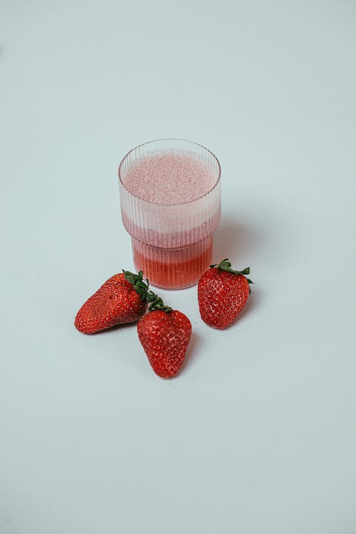 Photo of Strawberries Near a Strawberry Smoothie // Healthier Me Today