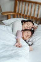 Photo of Woman and Girl Lying on Bed // Healthier Me Today