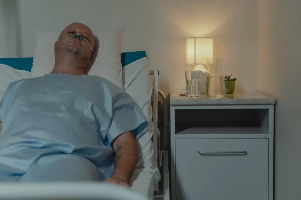 Sick Man Lying on Hospital Bed // Healthier Me Today