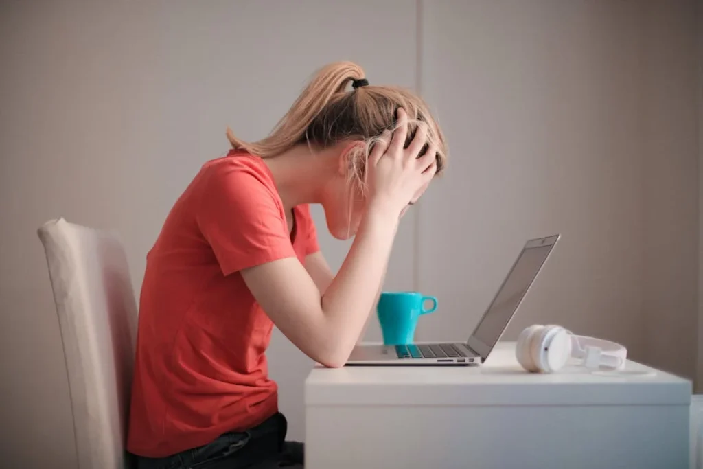 Woman in Red T-shirt Looking at Her Laptop // Healthier Me Today