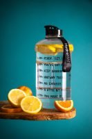 Slice Lemon Beside Glass Pitcher on Wooden Table // Healthier Me Today
