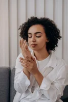 Woman in White Dress Shirt Smelling Her Wrist // Healthier Me Today